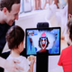 Facebook CEO Mark Zuckerberg shows unnamed kids one of the social media giant’s latest in-home spy devices
